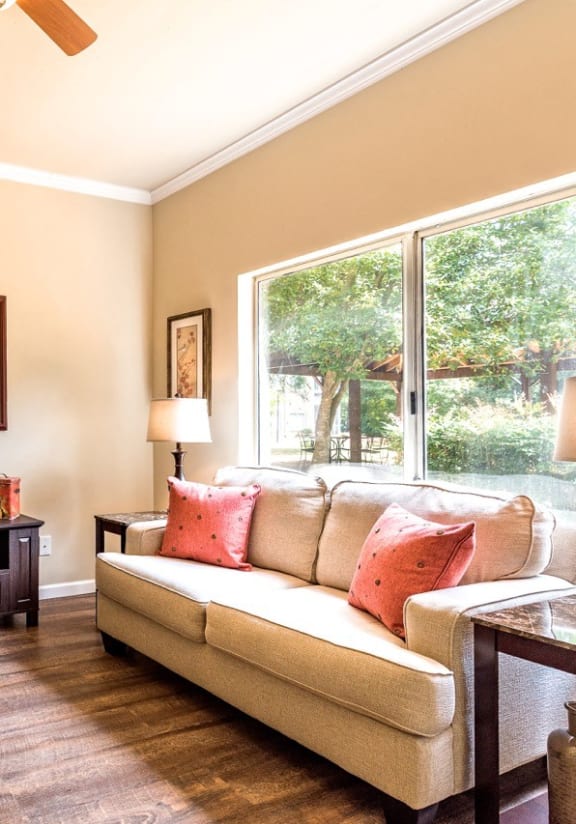 a living room with a couch and a window