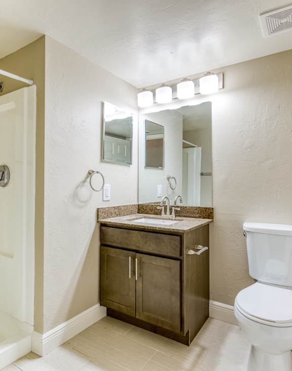 a bathroom with a toilet and a sink