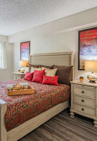 Bedroom with a large bed at Palazzo Senior Apartments - 55+ Active Adult Apartments, Phoenix, AZ