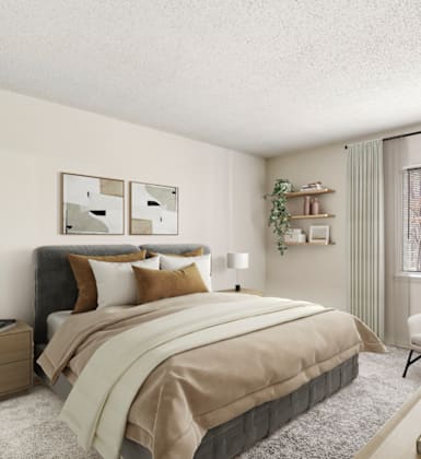 a bedroom with a large bed and a desk with a chair