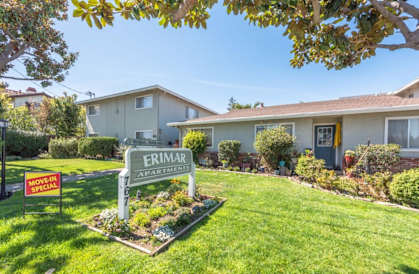 a house with a yard with a sign in front of it