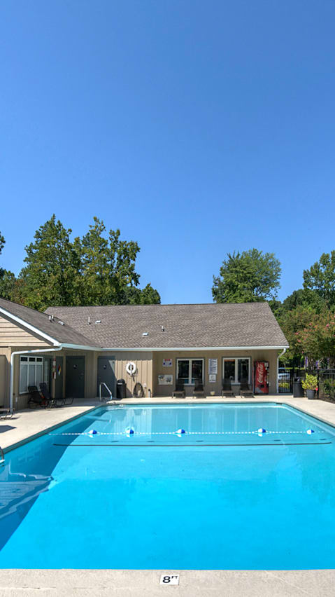 A green canopy is over a picnic table. at Eastchester Ridge Apartments, North Carolina, 27262