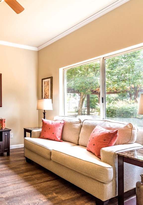 a living room with a couch and a window