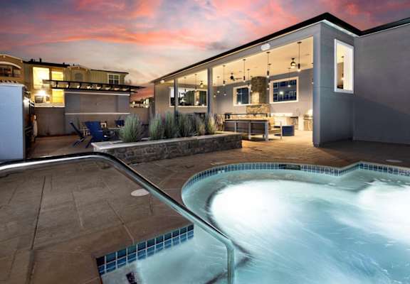 A modern house with a swimming pool in the backyard.