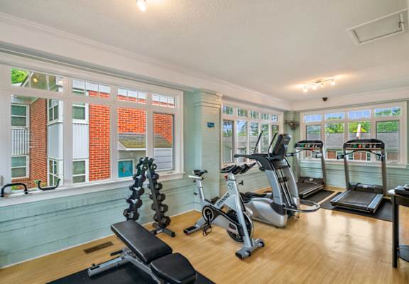 A home gym with a variety of exercise equipment.