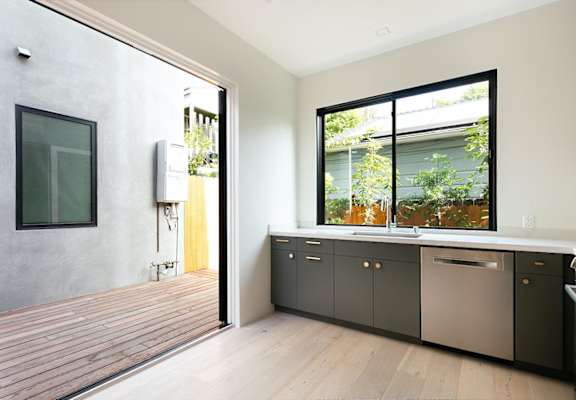 a kitchen with a sink and a window