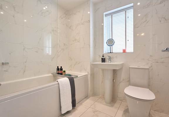 a bathroom with a sink toilet and a bath tub