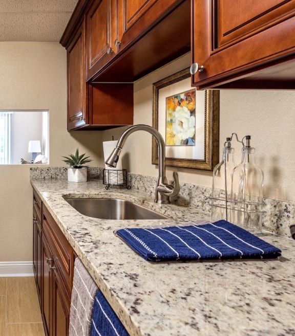 a kitchen with stainless steel appliances and granite counter tops