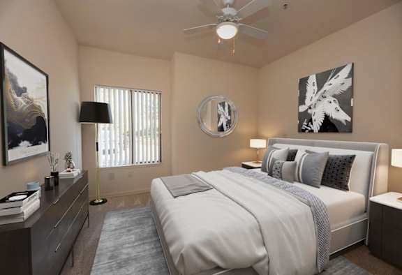 a bedroom with a bed and a ceiling fan