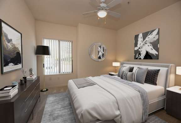 a bedroom with a white bed and a ceiling fan at Winding Commons Senior Living, Carmichael, CA