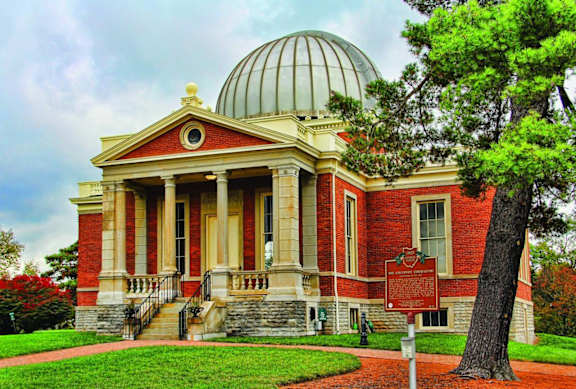 A red building with a dome and a sign in front of it.at Sky Central, Cincinnati Ohio