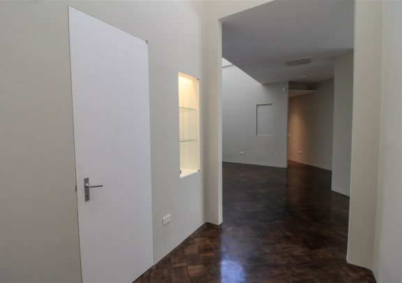 an empty room with white walls and a door at Metro67, Memphis, 38103