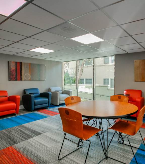 A conference room with a table surrounded by chairs at 430 Kelton, Los Angeles