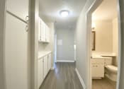 Thumbnail 8 of 46 - Hallway with view of bathroom and cabinets