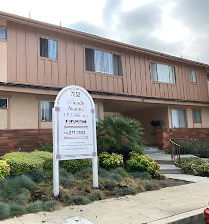 a building with a sign in front of it