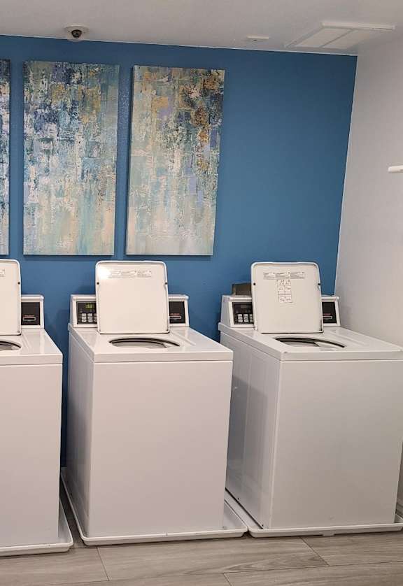 Laundry room at Versailles senior apartments