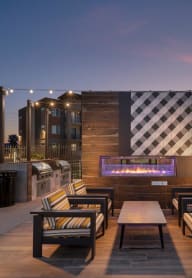 Outdoor Fireplace and seating with orange chairs at Hangar at Thunderbird, Glendale, AZ, 83506