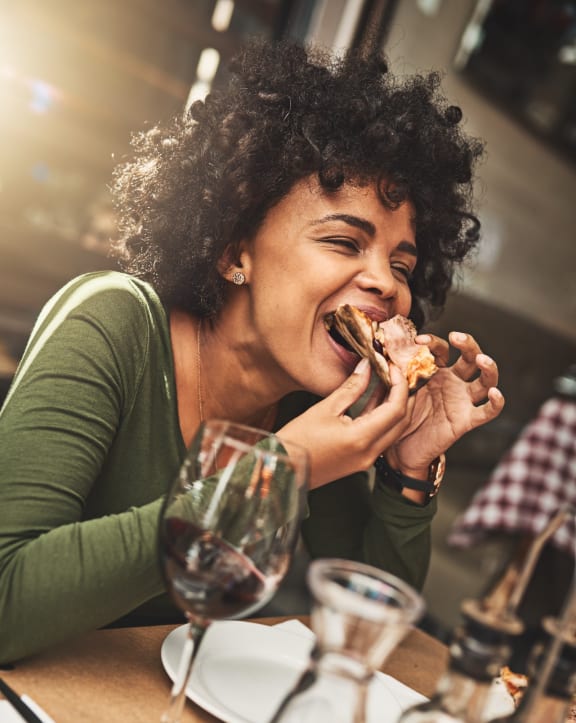 A Girl eating Pizza
