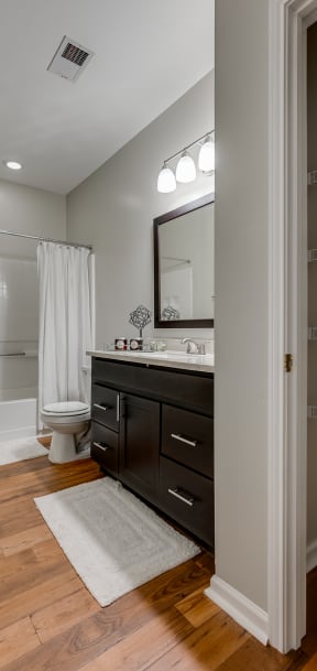 Bathroom with Closet Featuring Built-In Shelving