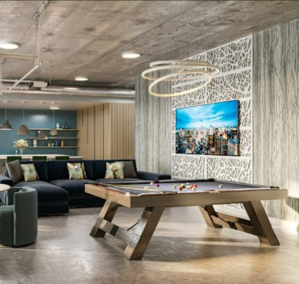 A modern living room with a pool table and a television.