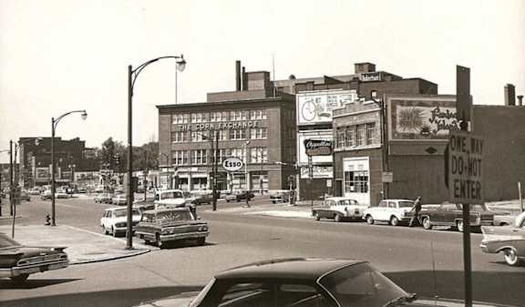 a black and white photo of a city street with cars at 100 South Apartments, Buffalo, NY 14202