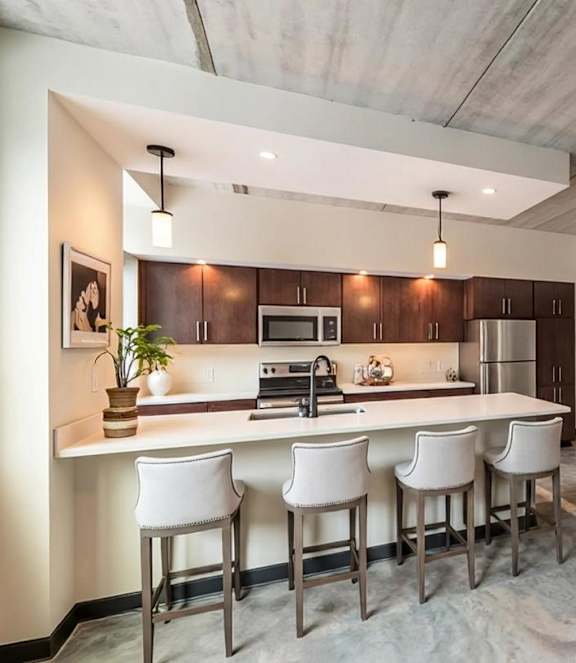 Kitchen with large island and chairs at The 503 Apartments, Dayton, OH