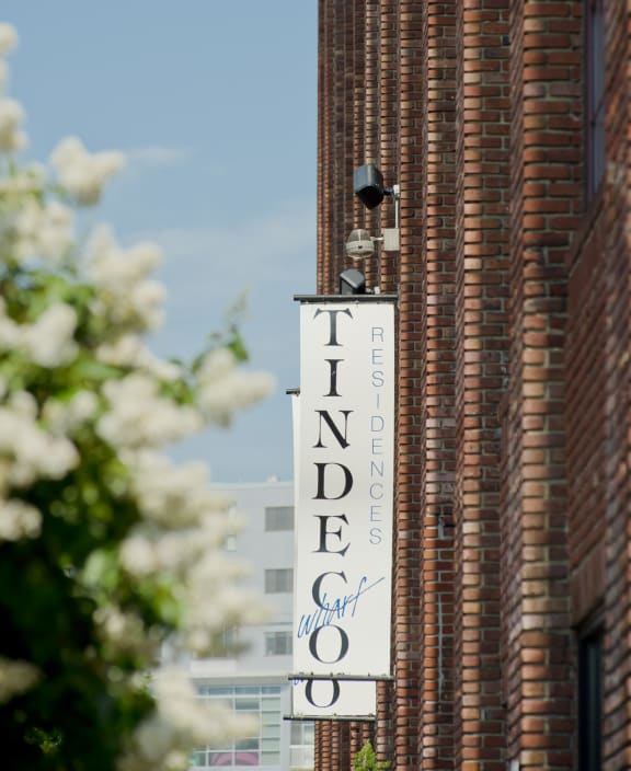 a sign on the side of a brick building at Tindeco Wharf, Baltimore, MD