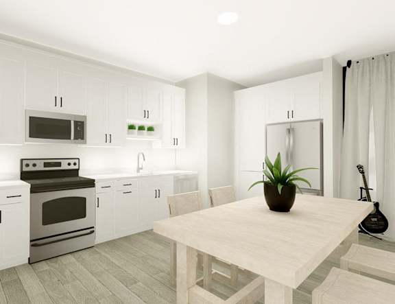 a white kitchen with a table and a refrigerator at The Pearl, Fort Wayne