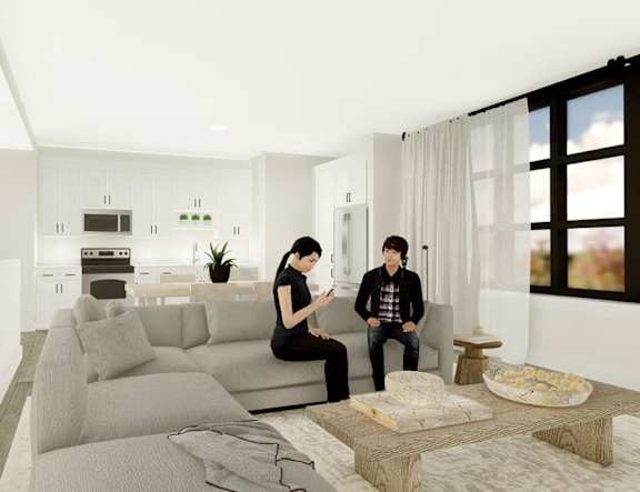 two people sitting on a couch in a living room at The Pearl, Indiana 46802