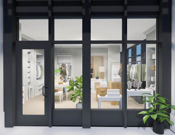 a model of a living room with large windows at The Pearl, Fort Wayne, IN