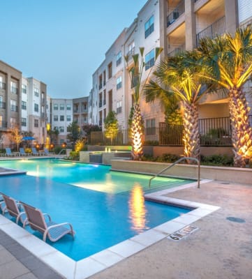 Pool with lounge chairs l Haven at Lake Highlands Apartments in Dallas Texas