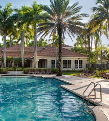 Pool with lounge chairs Banyan Pointe in Coconut Creek Florida