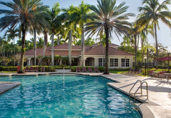 Pool with lounge chairs Banyan Pointe in Coconut Creek Florida 