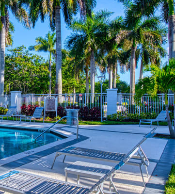 Pool with lounge chairs Aqua 2800 Apartments in Oakland Park Florida