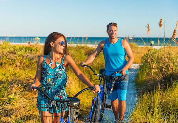 Couple with bikes at the beach Doral Terrace in Doral Florida at Doral Terrace, Doral, 33178