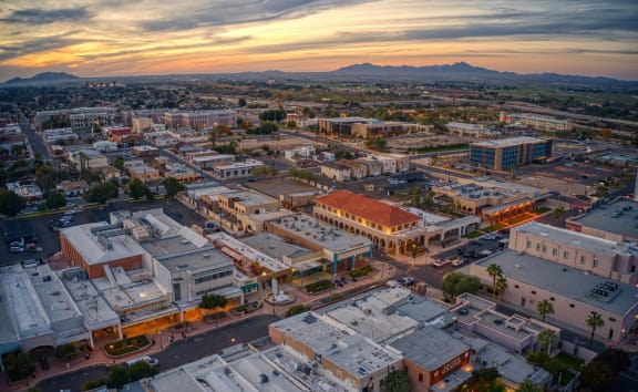 an aerial view of the city at sunset