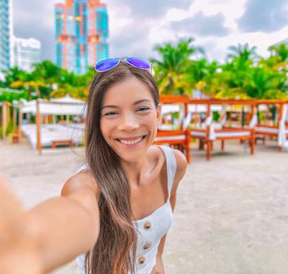 Woman at beach near cabanas at Hidden Cove, Miami, FL 33169