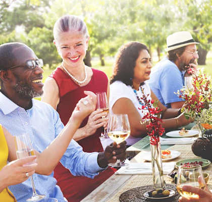 Lifestyle photo of friends having an outdoor meal at Mission Bay Apartments, Florida 32955