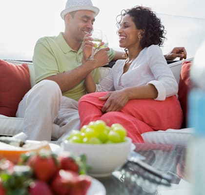 Couple sitting outside at Bernwood Trace Apartments, Florida