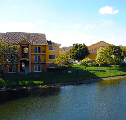 a view of a lake with houses next to it at Indian Trace, West Palm Beach Florida