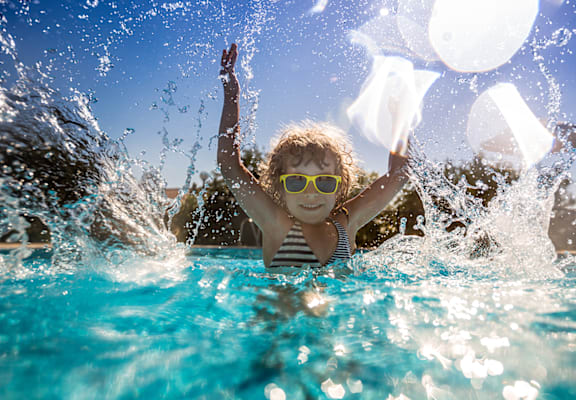 Child in pool at Bernwood Trace Apartments, Florida