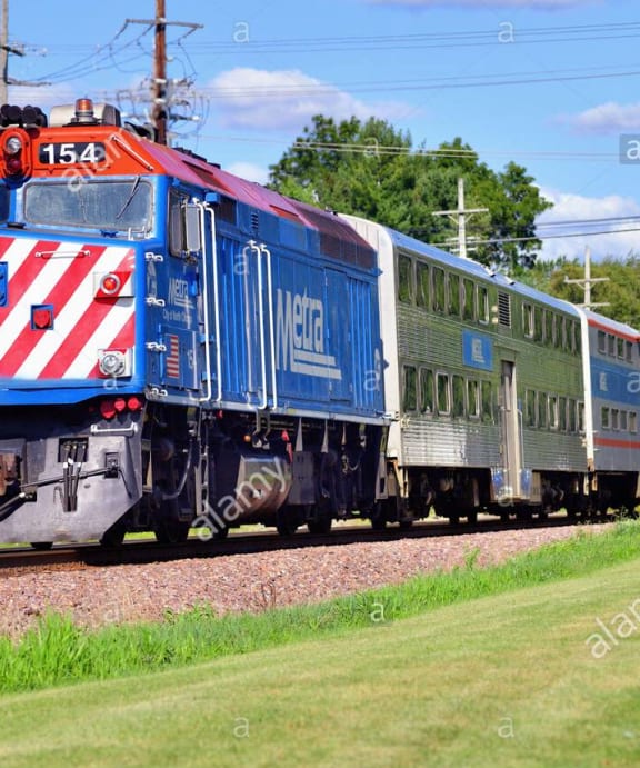a train traveling down the tracks in the country