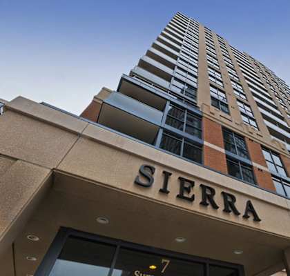 A tall building with the word Sierra on the front.