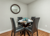 Thumbnail 7 of 13 - Dining room with table and four chairs