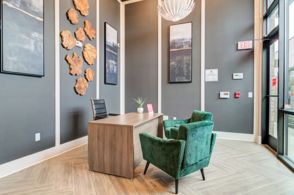 Sky Harbor Apartments in Chamblee, GA photo of a a brick building with large glass windows and a sidewalk