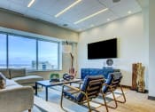 Thumbnail 11 of 33 - living room looking out over a city at The Grand, Kansas City, 64106