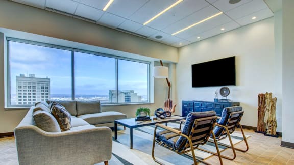 living room looking out over a city at The Grand, Kansas City, 64106