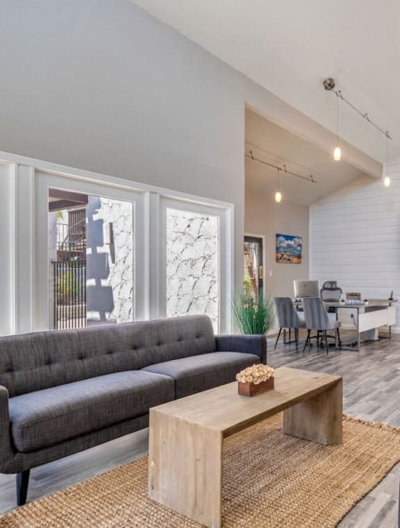 a large living room with a kitchen and a dining room