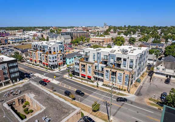 an aerial view of a city street and some buildings