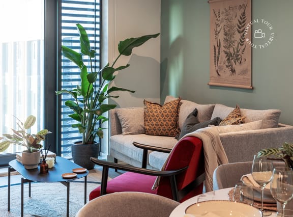 a living room and dining room with a table and chairs